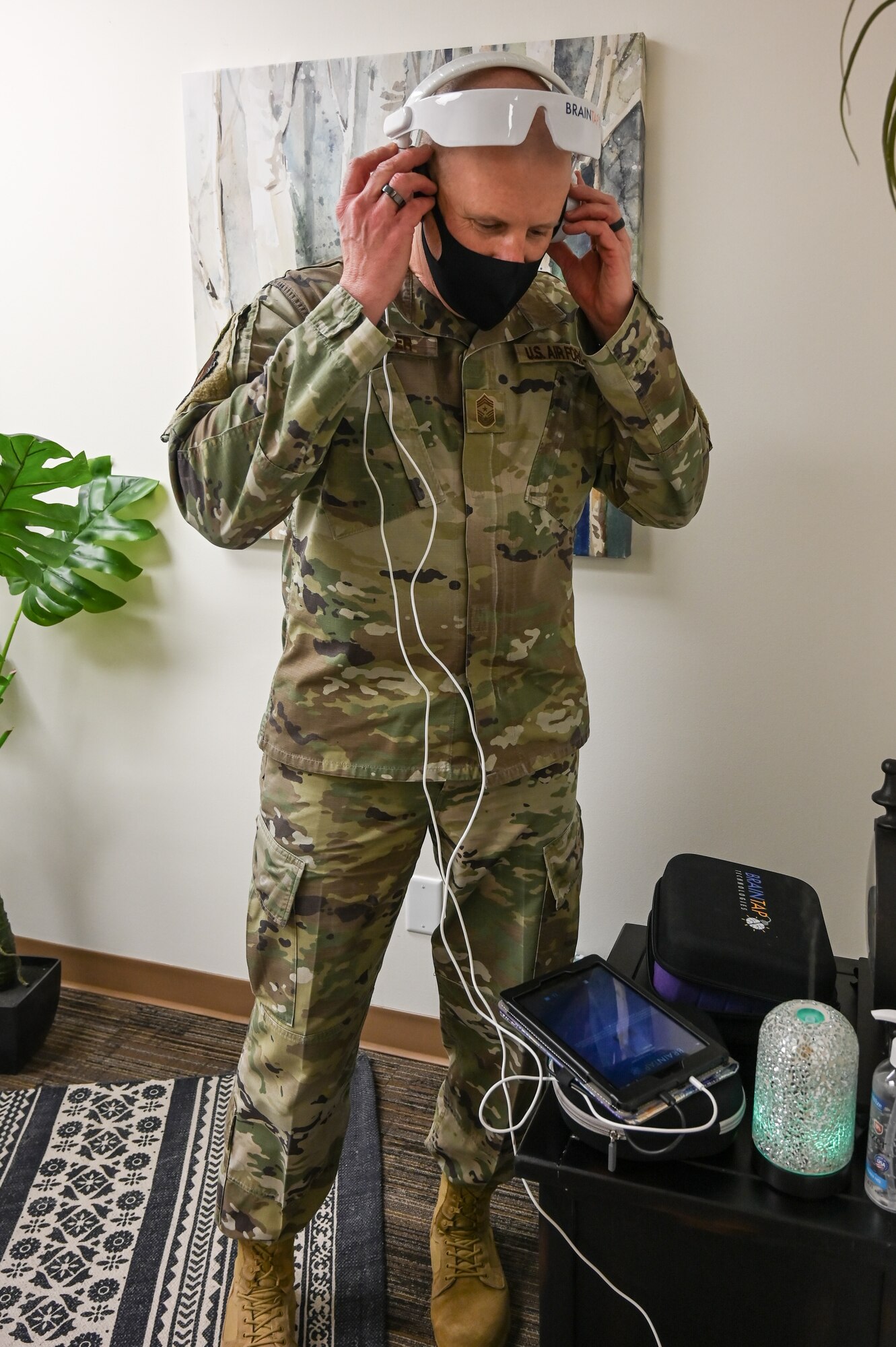 Chief Master Sgt. Christopher Walker tries a guided meditation headset.