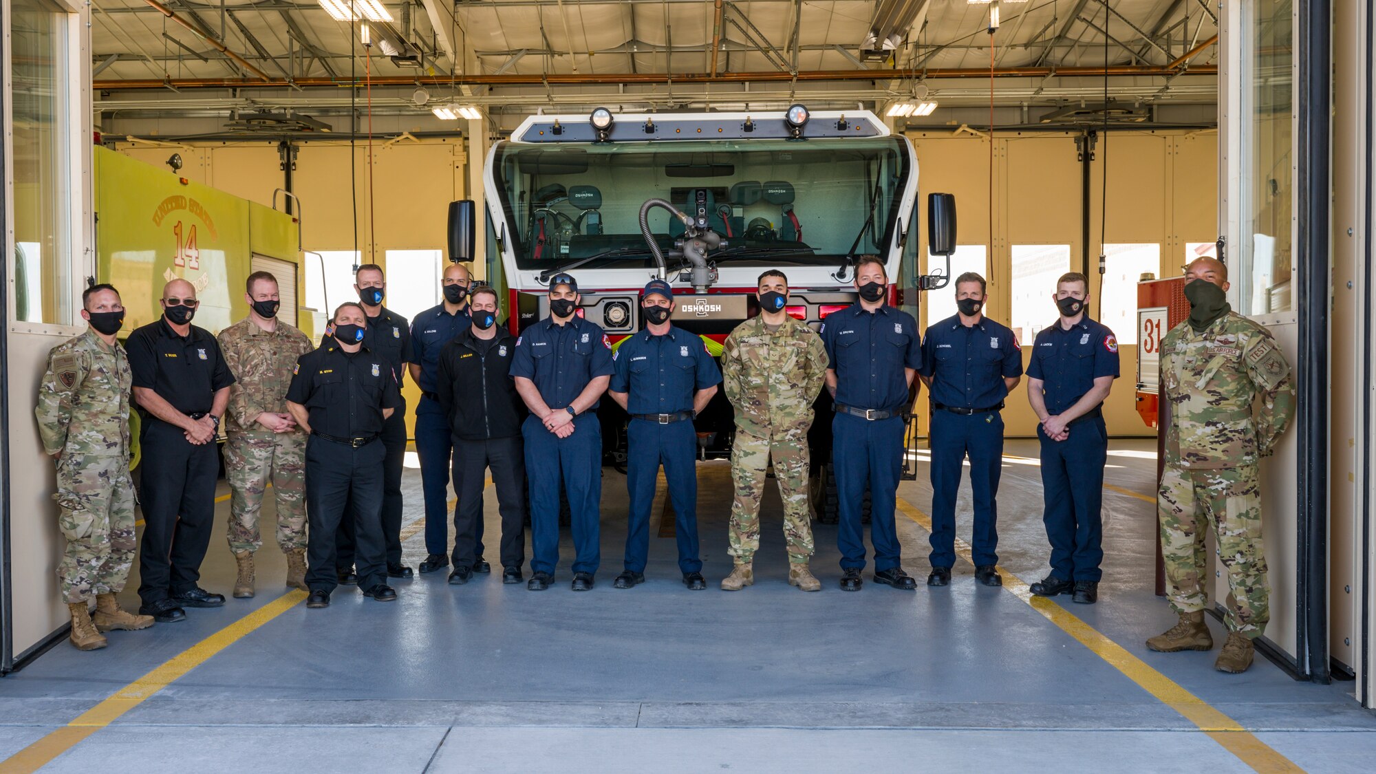 The 412th Test Wing Vice Commander, Col. Randel Gordon, and Wing Command Chief, Chief Master Sgt. Ian Eishen, joined the 812th Civil Engineer Squadron's Fire and Emergency Services Flight for a special "Push In" ceremony to officially welcome their newest Aircraft Rescue Fire Fighting (ARFF) vehicle at Edwards Air Force Base, California, Jan. 14. (Air Force photo by Chris Dyer)