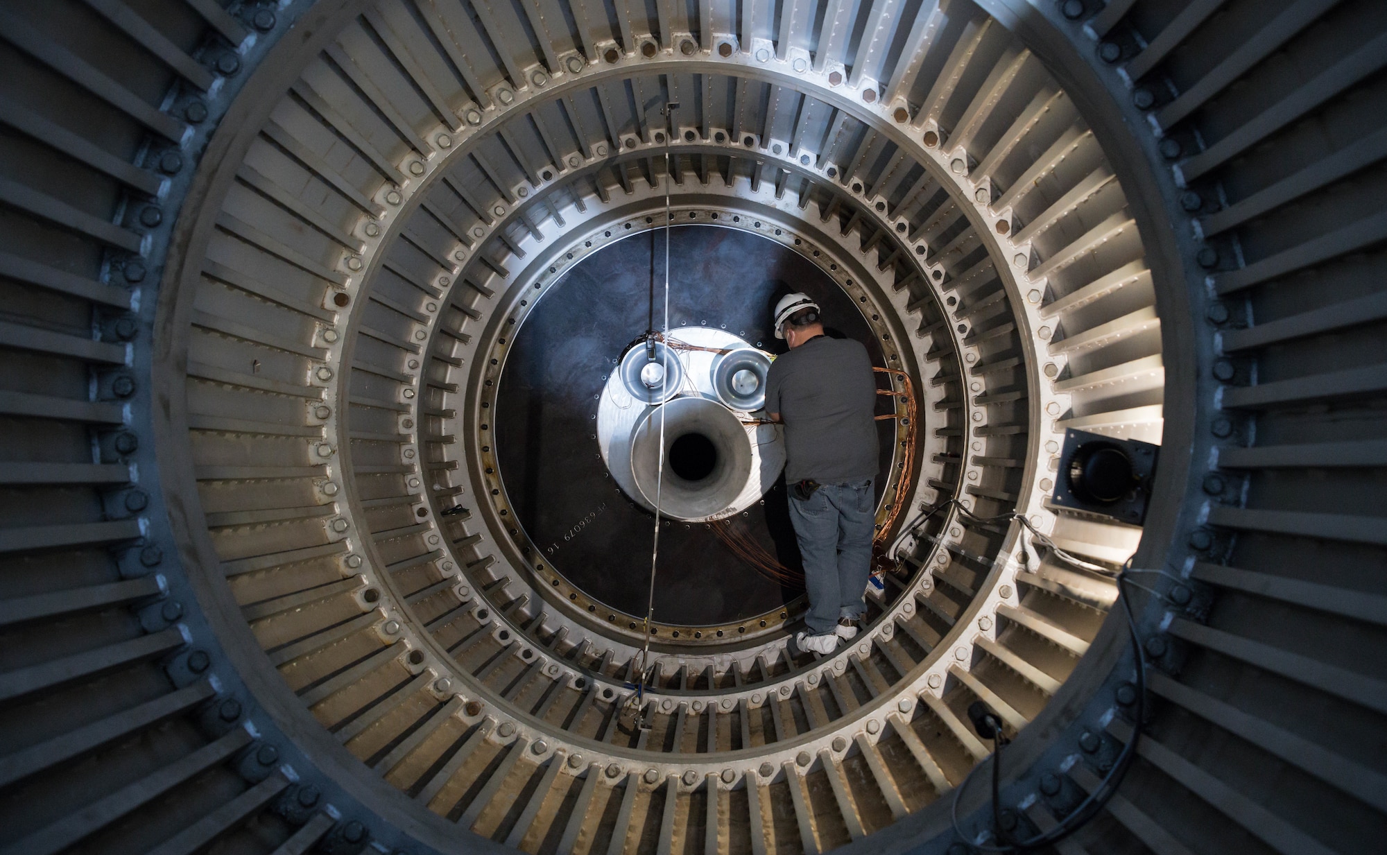 Jay Caldwell, an outside machinist, works on venturis mounted inside the scavenging scoop in the 16-foot supersonic wind tunnel, Nov. 3, 2020, at Arnold Air Force Base, Tenn. The scoop was modified to allow for the calibration of a large-scale mass flow assembly. (U.S. Air Force photo by Jill Pickett)