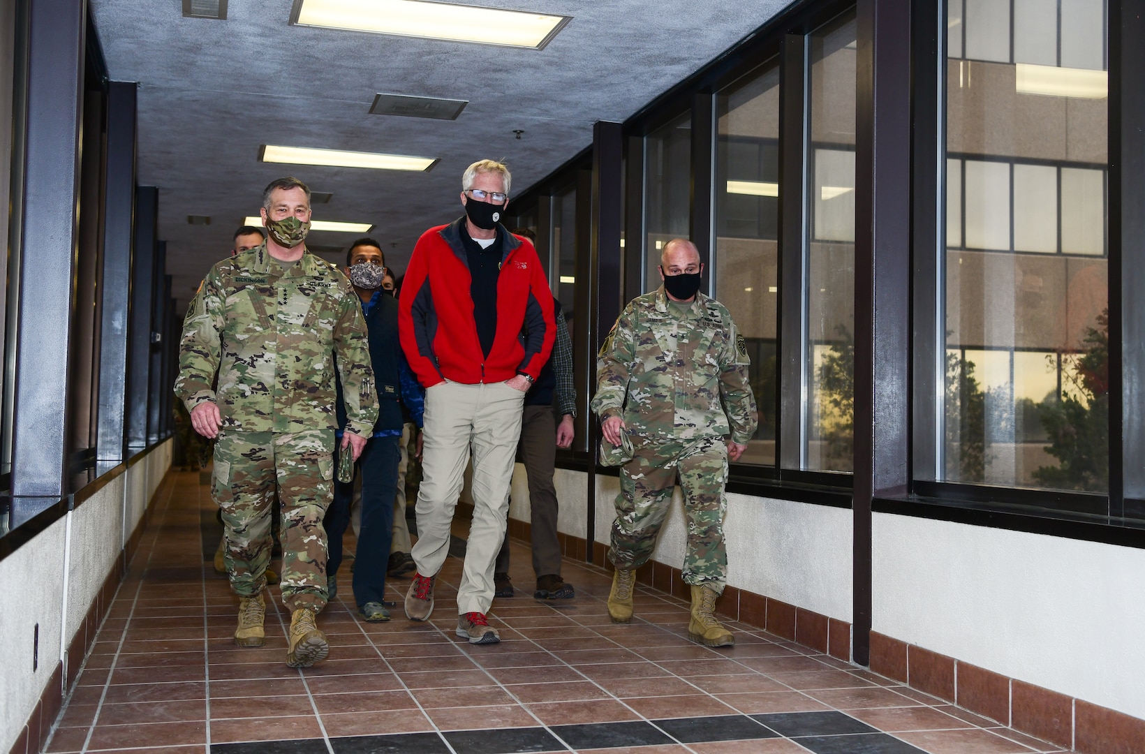 Military leaders escort honorable Christopher C. Miller, acting Secretary of Defense, to the National Space Defense Center for combatant command mission discussions at Schriever Air Force Base, Colorado, Jan. 13, 2021.