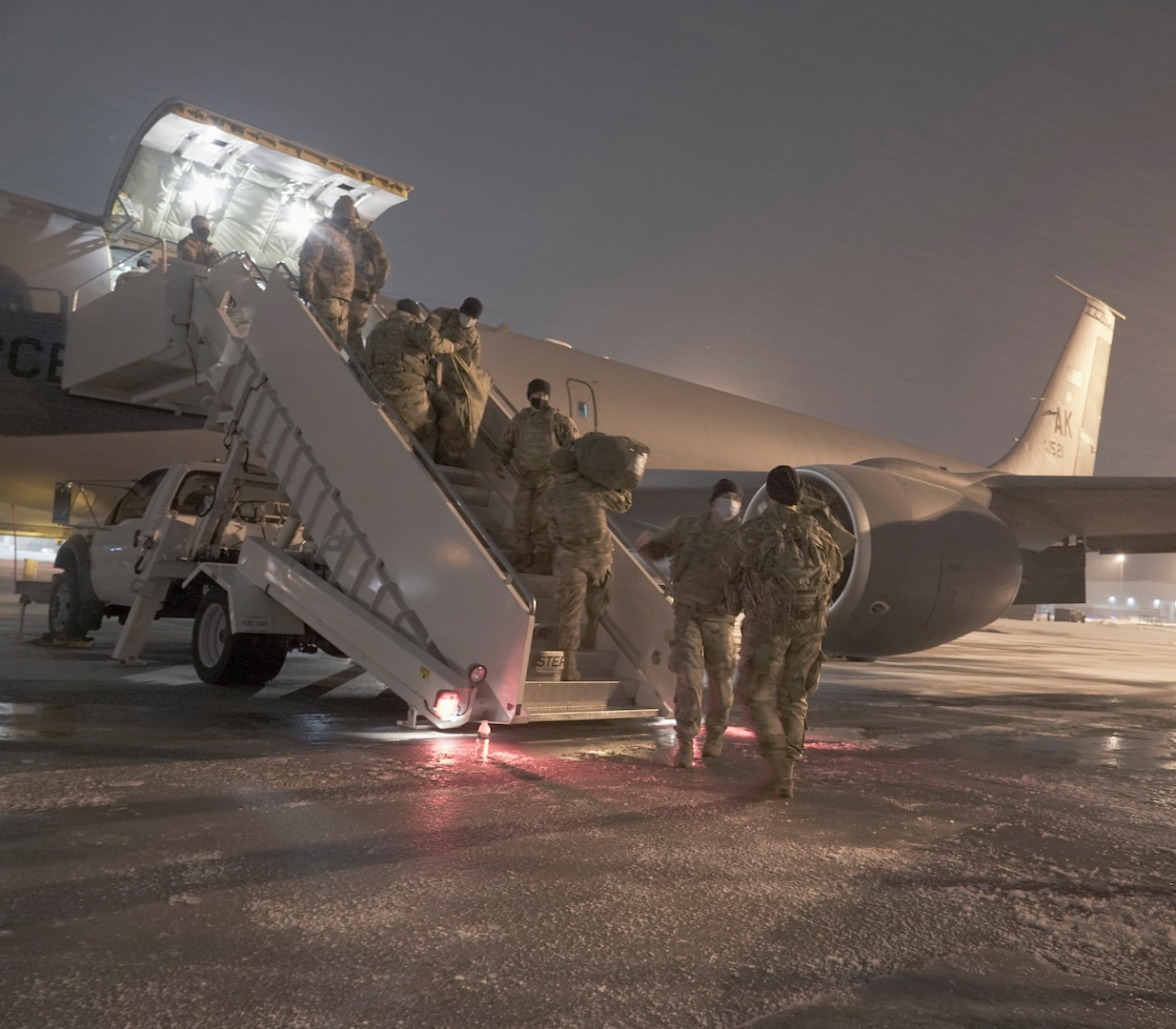 Alaska National Guard Soldiers and Airmen load gear and equipment onto an Alaska Air National Guard KC-135 Stratotanker, Jan. 19, 2021, before traveling to Washington to support the 59th presidential inauguration. The Alaska National Guard joins Guard members from every state and three territories in the nation’s capital to assist the Secret Service and District of Columbia authorities.