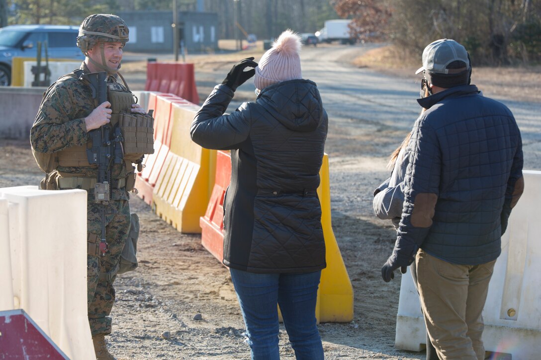 U.S. Marine Corps Staff Sgt. Eric Thompson, Charlie Fast Company, 5th Platoon Sergeant, Marine Corps Security Forces, U.S. Marine Corps Forces Command, Fleet Marine Force Atlantic, speaks with role players acting as local civilians during a Mission Readiness Exercise (MRX) Jan 12, 2021, on Fort A. P. Hill in Port Royal, Virginia. Fleet Antiterrorism Security Team (FAST) platoons execute MRX exercises prior to deployment to evaluate the platoons’ proficiency in core mission essential tasks. (U.S. Marine Corps Photo by Sgt. Desmond Martin/Released)