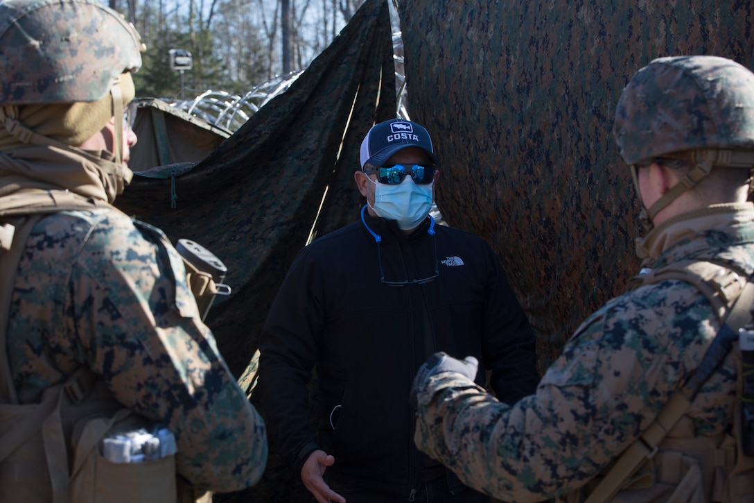 U.S. Marine Corps Lance Cpl. Luis Perezrosario, left, and Sgt. Braxton Bosehart, right, military police officers with Charlie FAST Company, 5th Platoon, Marine Corps Security Force Regiment, performs security checks on a role player during a Mission Readiness Exercise (MRX) Jan 13, 2021, on Fort A. P. Hill in Port Royal, Virginia. Fleet Antiterrorism Security Team (FAST) platoons execute MRX exercises prior to deployment to evaluate the platoons’ proficiency in core mission essential tasks. (U.S. Marine Corps Photo by Sgt. Desmond Martin/Released)
