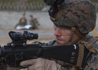 U.S. Marine Corps Cpl. Jacob Cousins, a military police officer with Charlie FAST Company, 5th Platoon, Marine Corps Security Forces, U.S. Marine Corps Forces Command, Fleet Marine Force Atlantic, provides security for casualty during a Mission Readiness Exercise (MRX) Jan 13, 2021, on Fort A. P. Hill in Port Royal, Virginia. Fleet Antiterrorism Security Team (FAST) platoons execute MRX exercises prior to deployment to evaluate the platoons’ proficiency in core mission essential tasks. (U.S. Marine Corps Photo by Sgt. Desmond Martin/Released)
