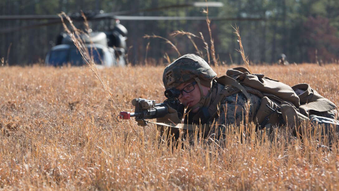 U.S. Marine Corps Sgt. Zachary Gaines, a military police officer with Charlie FAST Company, 5th Platoon, Marine Corps Security Forces, U.S. Marine Corps Forces Command, Fleet Marine Force Atlantic, sights in while securing a landing zone during a Mission Readiness Exercise (MRX) Jan 14, 2021, on Fort A. P. Hill in Port Royal, Virginia. Fleet Antiterrorism Security Team (FAST) platoons execute MRX exercises prior to deployment to evaluate the platoons’ proficiency in core mission essential tasks. (U.S. Marine Corps Photo by Sgt. Desmond Martin/Released)