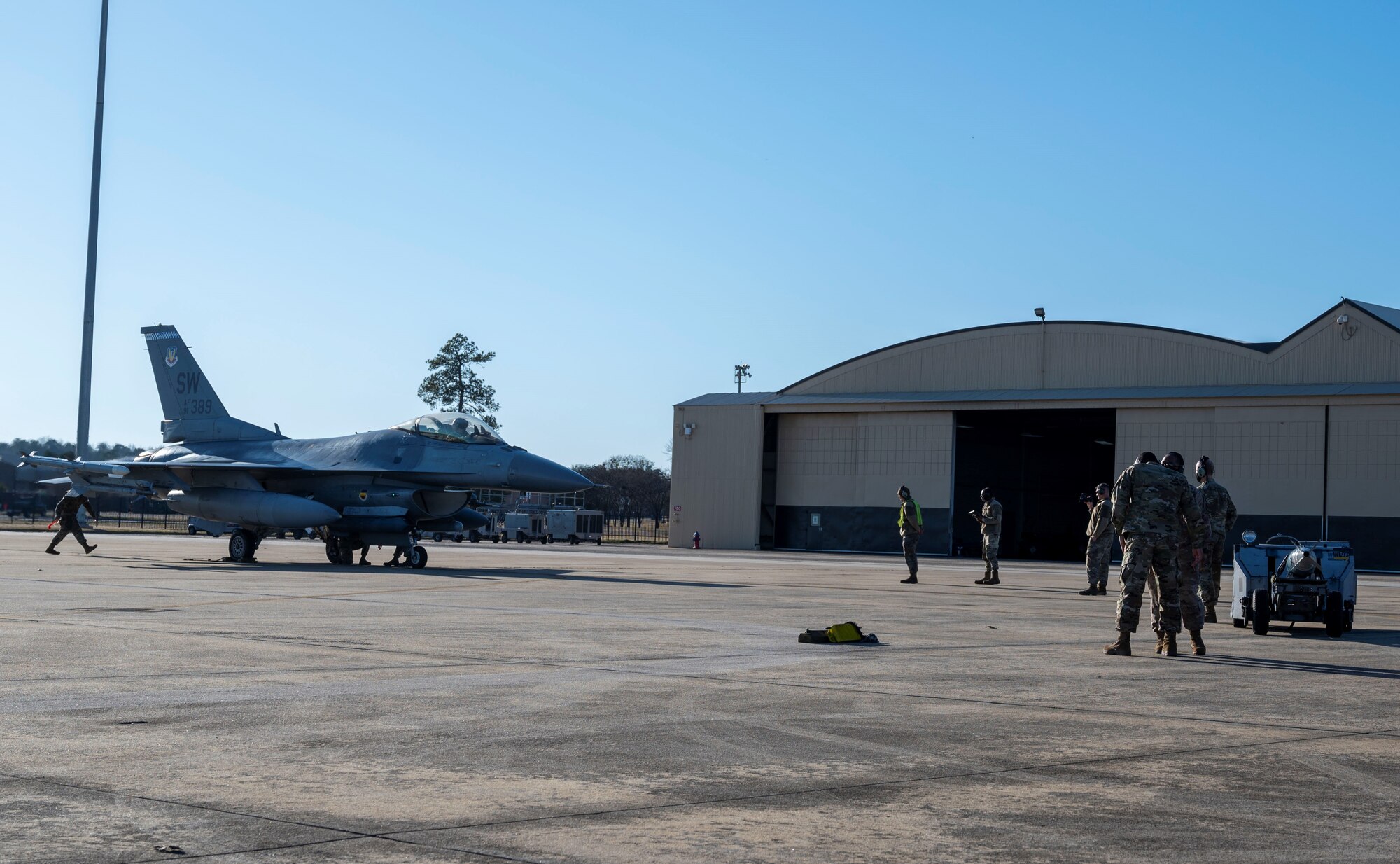 Photo of Airmen working on the flightline