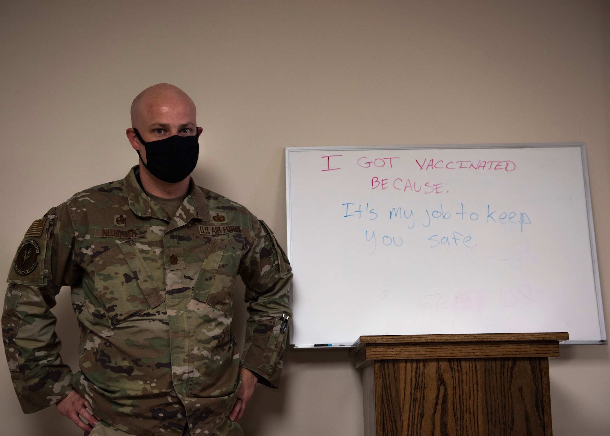 U.S. Air Force Maj. Andrew Neubauer, 366th Security Forces Squadron commander, writes why he received the vaccine, at Mountain Home Air Force Base, Idaho, Jan. 19, 2021. Neubauer was the first person to receive the first dose of the COVID-19 vaccine at MHAFB. (U.S. Air Force photo by Airman 1st Class Natalie Rubenak)