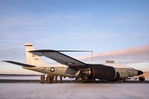 Security forces members listen to a RC-135S Cobra Ball team member Dec. 18, 2020, on Eielson Air Force Base, Alaska. 354th Security Forces Squadron personnel were able to learn about one of the three RC-135S platforms in the entire U.S. Air Force from the crew themselves, allowing them to understand the larger mission they defend every day. (U.S. Air Force photo by Senior Airman Keith Holcomb)