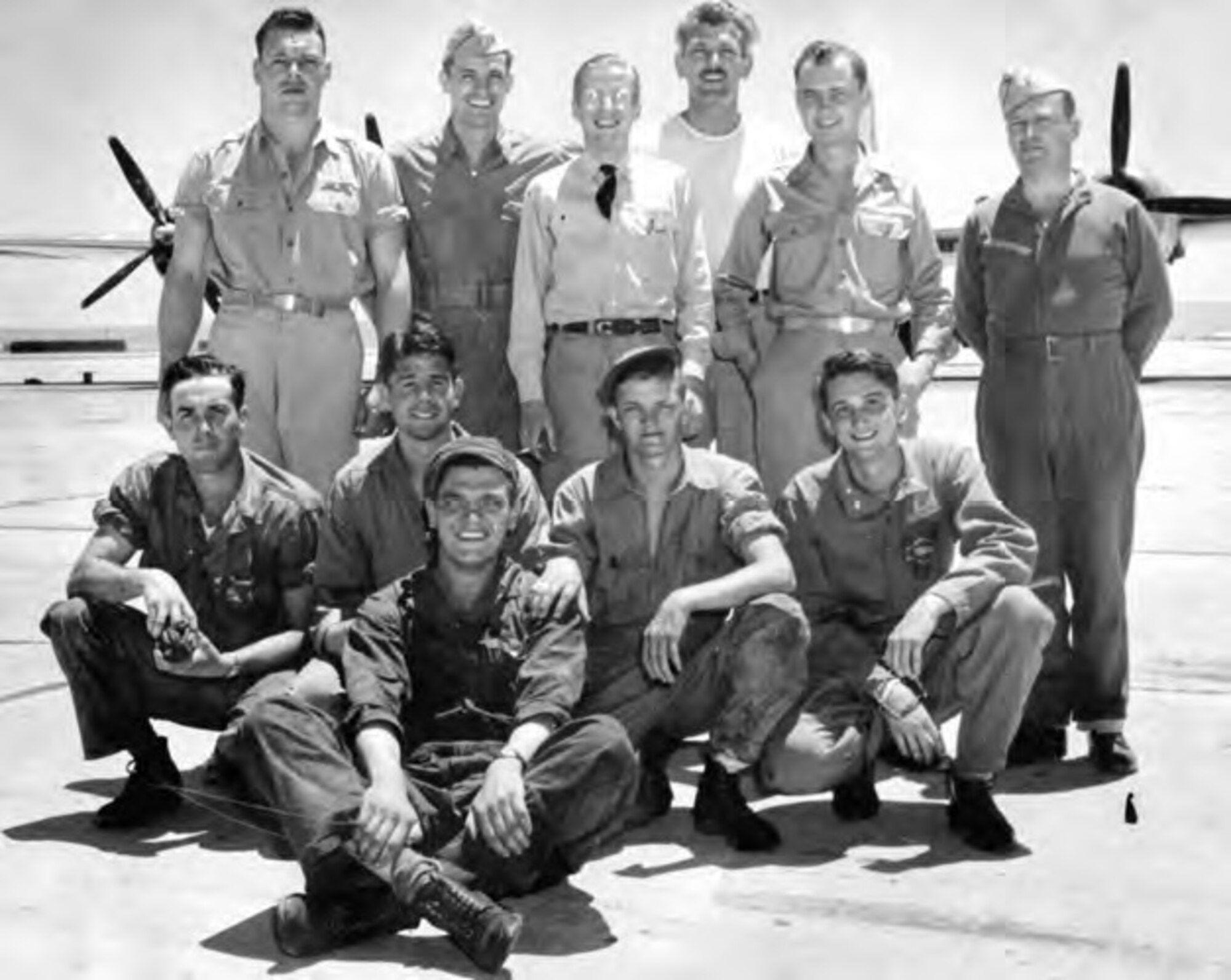 The crew of the Silverplate
first drop test B–29 aircraft,
at Muroc Army Air Field,
February 1944. Top row:
Shields, Wilkinson, Dike,
Storemen, Roark, Semple.
Middle row: Bender, Coles,
Merrill, unknown. Front:
Rochlitz. (Photo courtesy
of Keith Shields