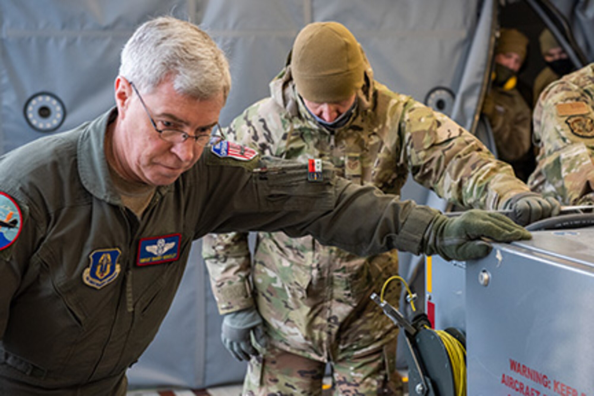 Senior Master Sgt. Barry Bradley, a boom operator from the 916th Air Refueling Wing, and Tech. Sgt. Michael Sizemore, an air transportation specialist from the 67th Aerial Port Squadron, push a training pallet into a KC-46A Pegasus, Jan. 10, 2021, at Hill Air Force Base, Utah.