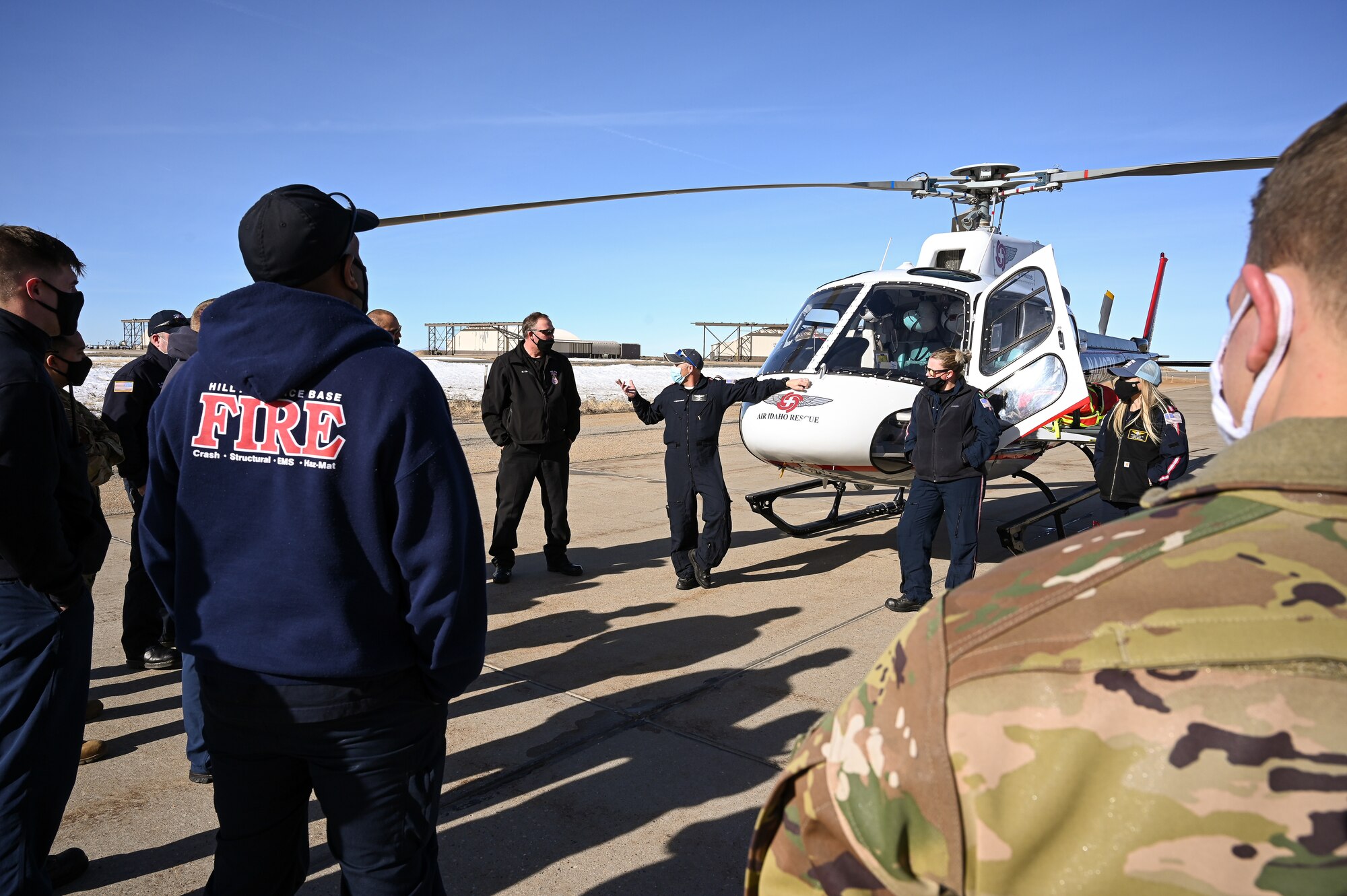 An AirLife Utah crew speaks with Hill firefighters during an air ambulance training event at Hill Air Force Base, Utah, Jan. 14. 2021. Hill's first responders conduct the annual training to remain proficient on air ambulance operations. The Ogden AirLife Utah base is located at Ogden Regional Medical Center. (U.S. Air Force photo by R. Nial Bradshaw)