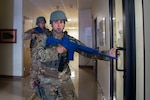 Senior Airman Jose Sanchez (right) and Staff Sgt. Mathew Moncivais, 902nd Security Forces Squadron, enter a room during an active shooter exercise on Aug 28, 2019, at Joint Base San Antonio-Randolph.