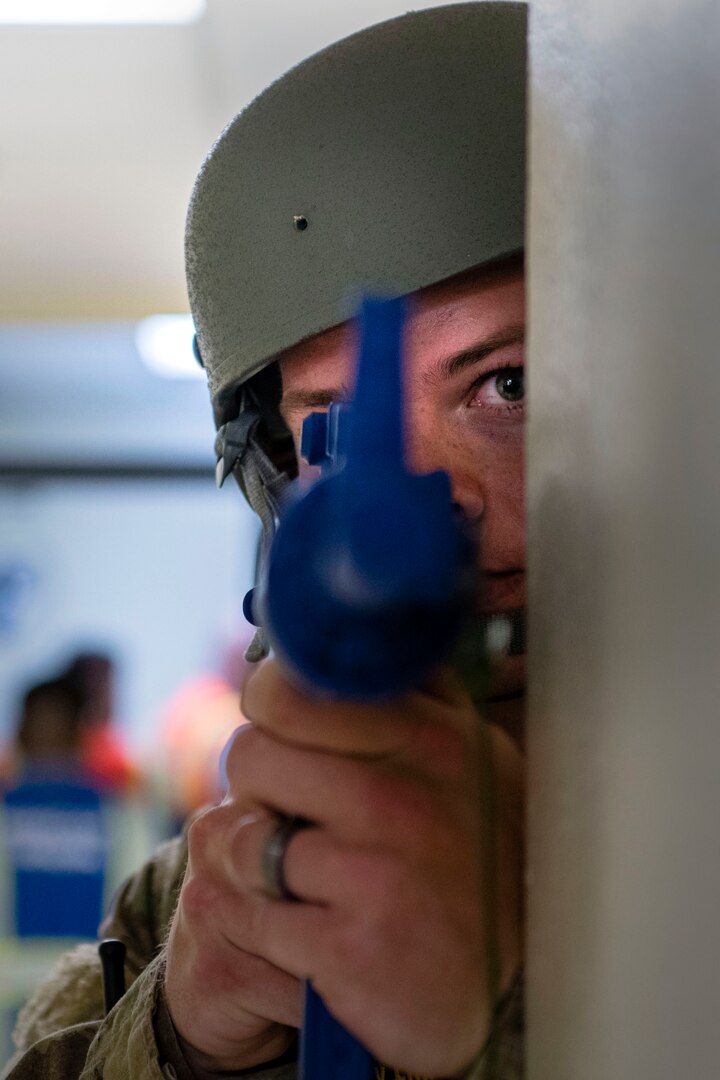 Senior Airman Gaige Bullard, 902nd Security Forces Squadron, scans a hallway during an active shooter exercise on Aug 28, 2019, at Joint Base San Antonio-Randolph.