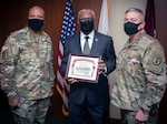 BAMC command team present certificate