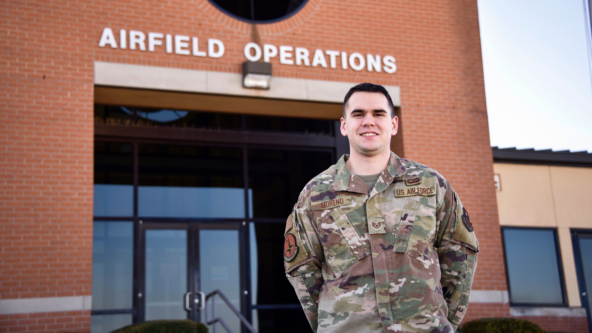 Staff Sgt. Robert Moreno stands in front of the Air Operations Complex at Sheppard Air Force Base