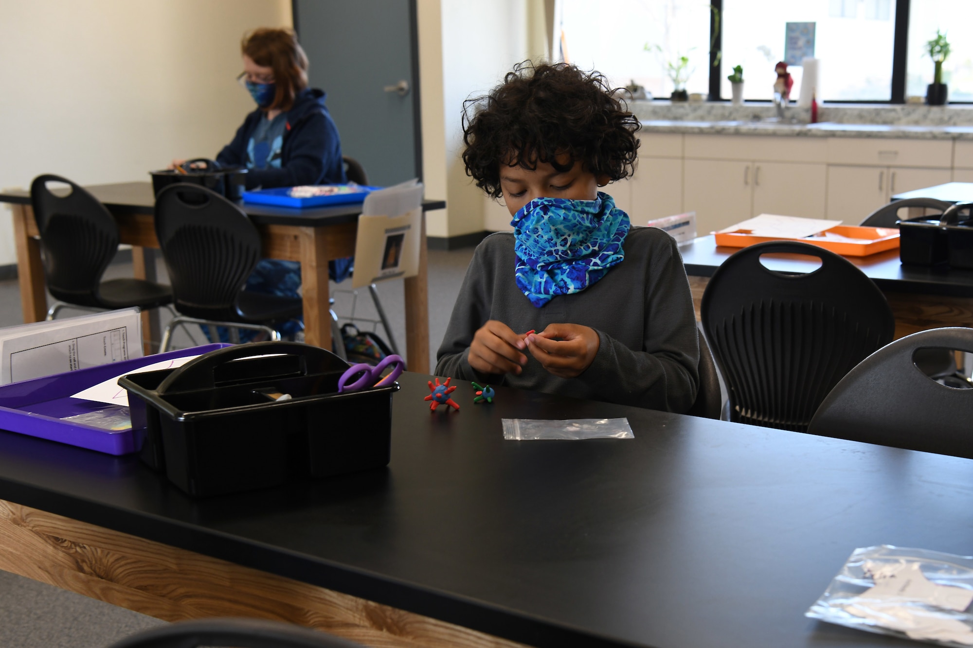 Elijah Winder and Jack Hamel mold viruses and antibodies out of clay during the Disease Ecology and Viruses STARBASE Vandenberg class Jan. 13, 2021, at Vandenberg Air Force Base, Calif.