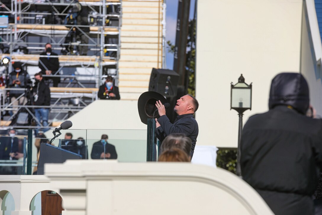 Garth Brooks performes "Amazing Grace" during the 2021 Inauguration Ceremony. Marine Band trumpeter Master Gunnery Sgt. Matthew Harding provided accompaniment during the performance.

(U.S. Marine Corps photo by Master Gunnery Sgt. Amanda Simmons/released)
