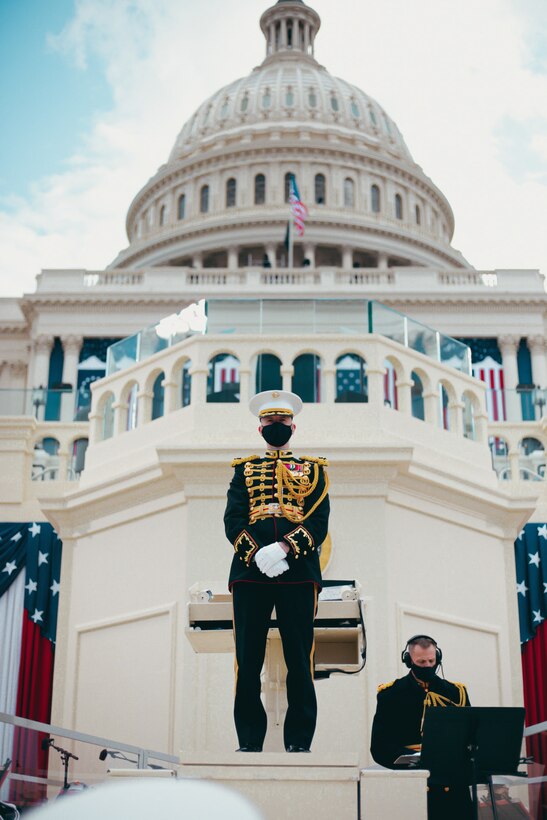 Col. Jason K. Fettig, Director of the United States Marine Band, stands at the podium before the start of the 2021 Inaugural Ceremony.