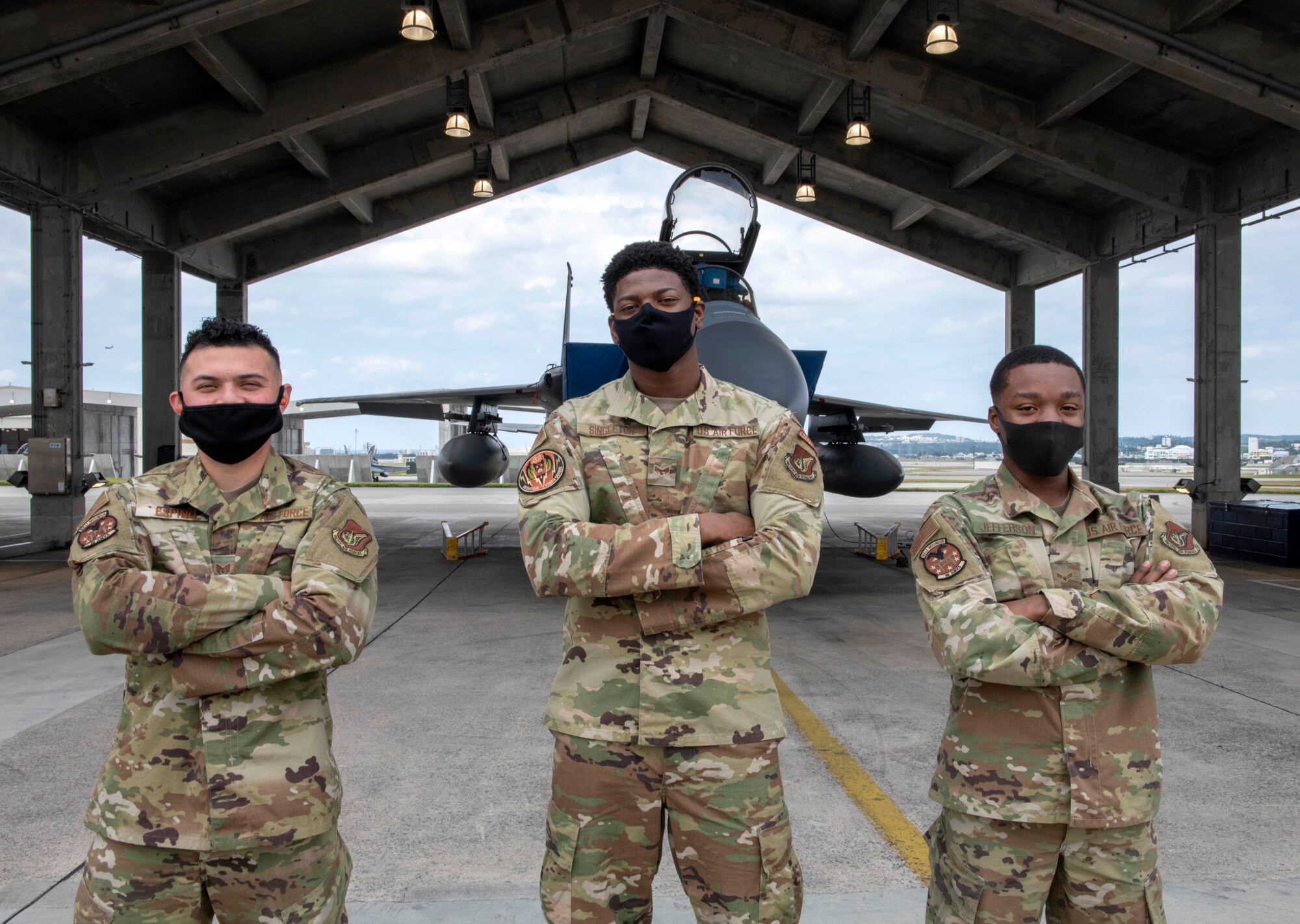 U.S. Air Force load crew members from the 44th Aircraft Maintenance Unit pose in front of an F-15C Eagle before the quarterly weapons load competition at Kadena Air Base, Japan, Jan. 14, 2021. Teams from the 44th and 67th AMUs competed for quickest and most accurate load of the weapons on their respective aircraft. (U.S. Air Force photo by Naoto Anazawa)