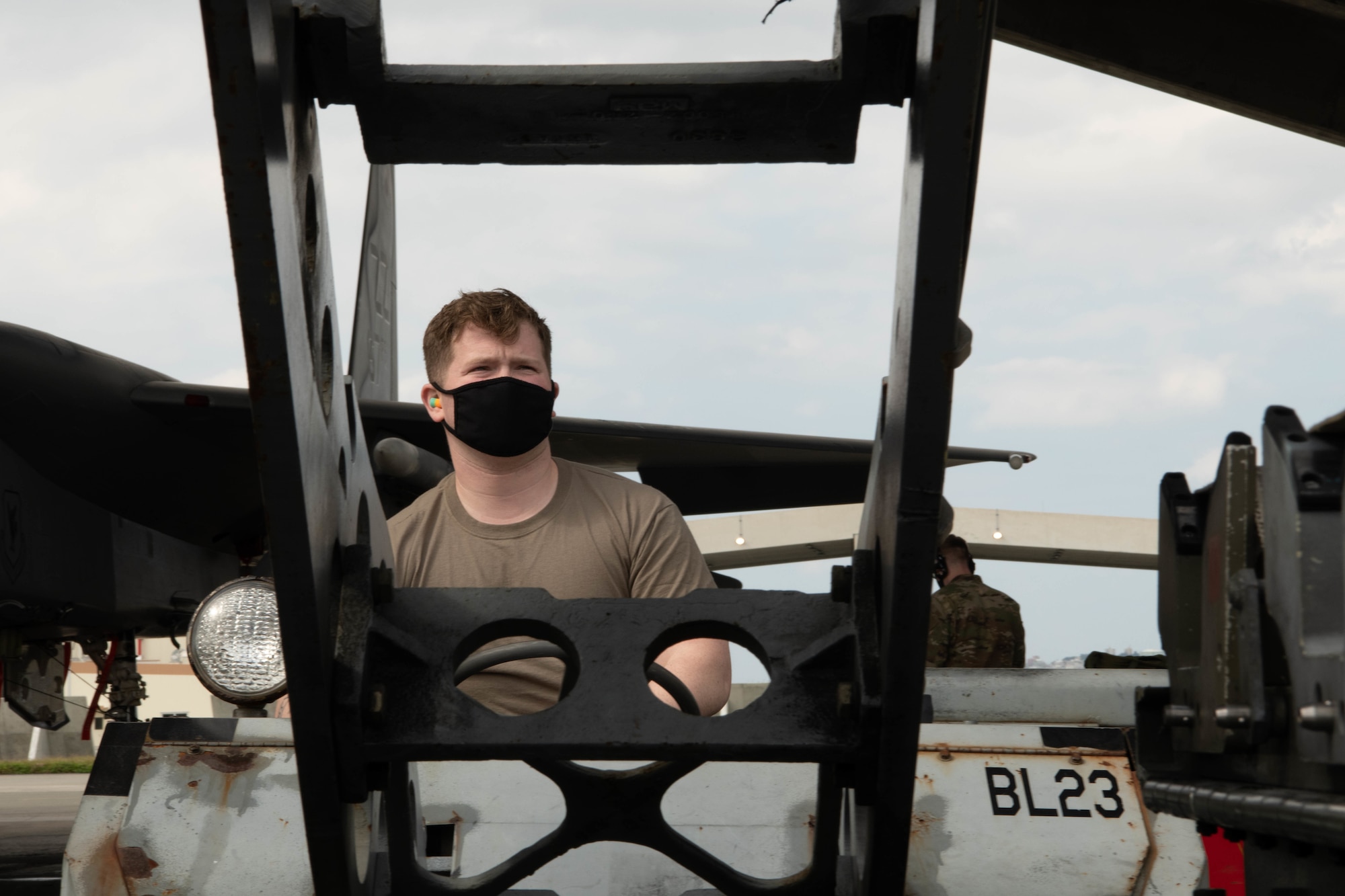 U.S. Air Force Senior Airman John Whitaker, a weapons load crew member, from the 67th Aircraft Maintenance Unit, competes in the quarterly load competition at Kadena Air Base, Japan, Jan. 15, 2021. The 67th AMU won the quarterly load competition against the 44th AMU. (U.S. Air Force photo by Airman First Class Stephen Pulter)