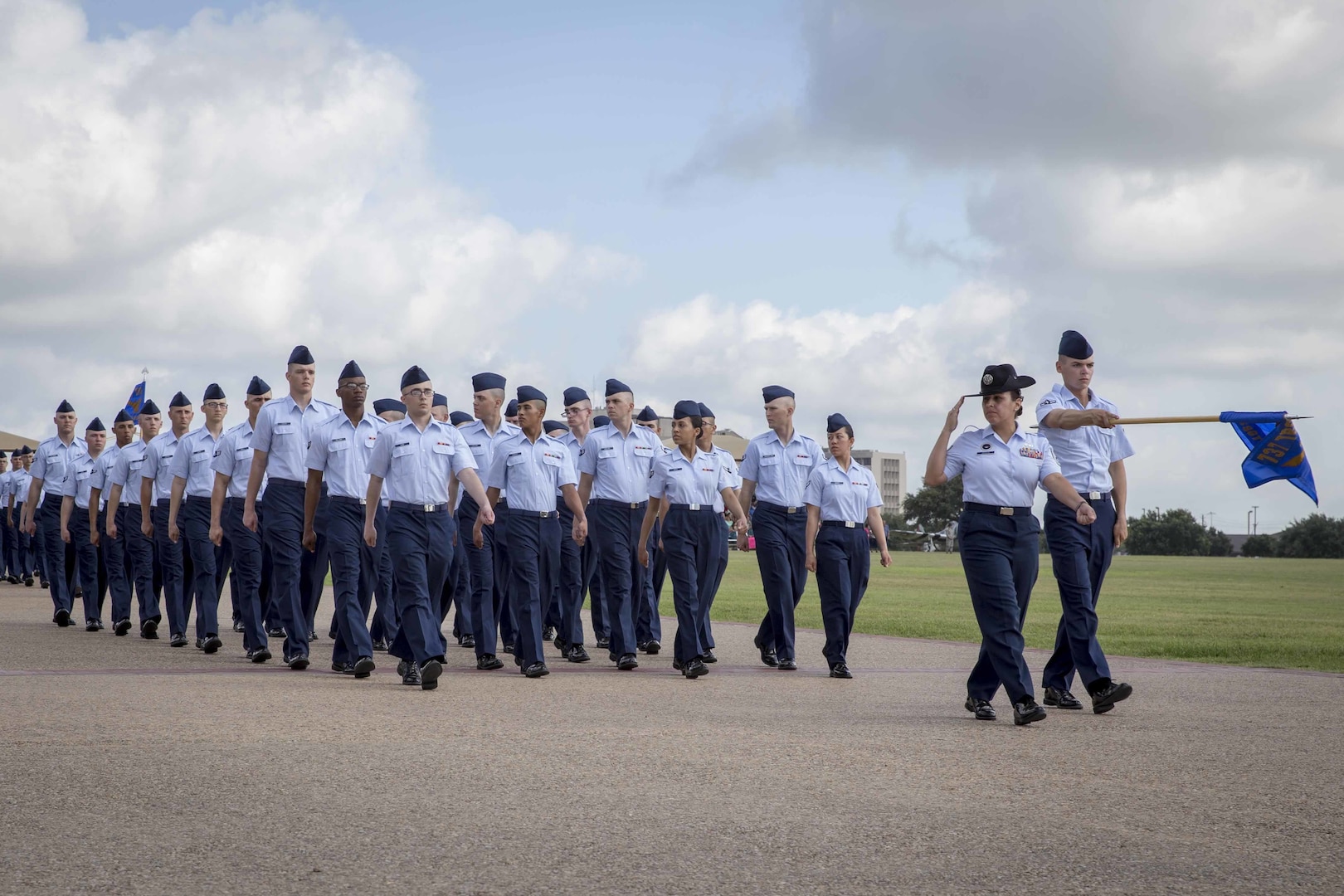 Airmen march in integrated Heritage Flights during the Air Force Basic Training Graduation Parade July 17, 2015.