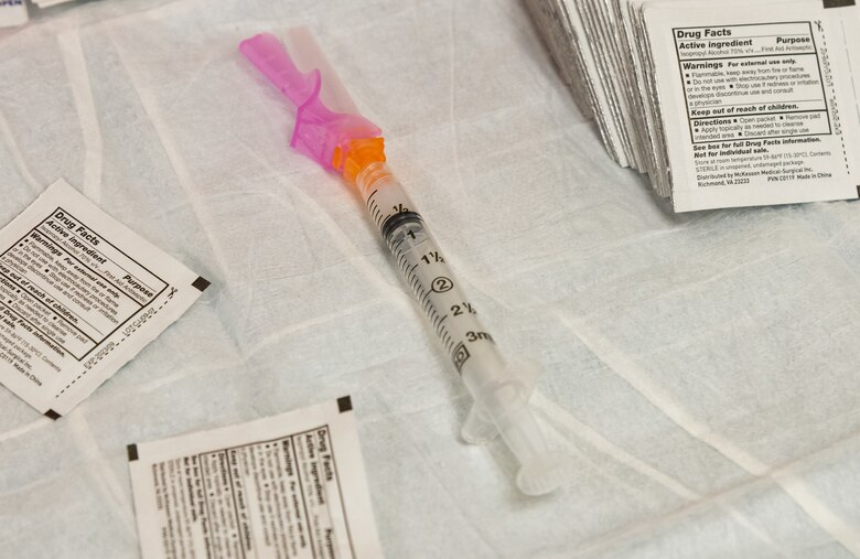 A syringe containing the COVID-19 vaccine is ready to be administered Jan. 15, 2021, at Dover Air Force Base, Delaware. Team Dover frontline workers voluntarily received the vaccine in concurrence with Department of Defense guidance. The vaccine was granted emergency use authorization by the U.S. Food and Drug Administration for use in prevention of COVID-19. (U.S. Air Force photo by Roland Balik)