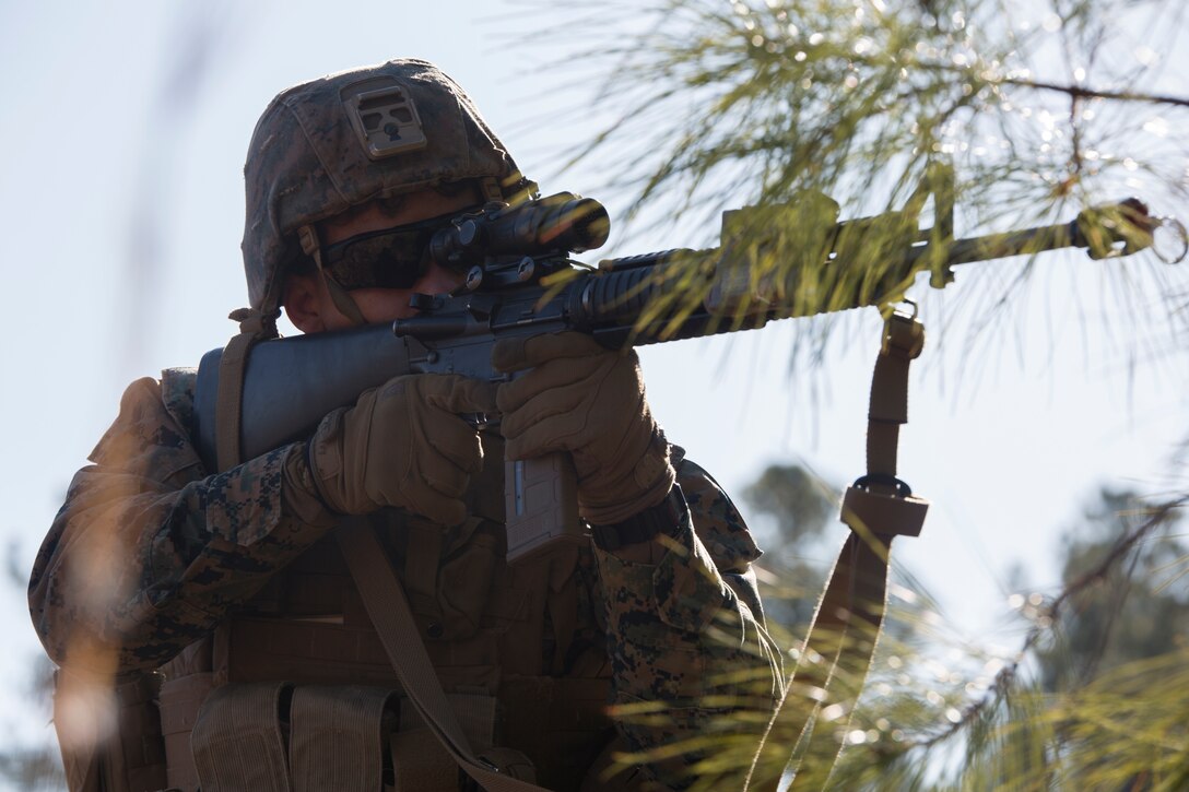 U.S. Marine Corps Lance Cpl. Drashan Marrow, a military police officer with Charlie FAST Company, 5th Platoon, Marine Corps Security Forces, U.S. Marine Corps Forces Command, Fleet Marine Force Atlantic, aims down sight while securing a landing zone during a Mission Readiness Exercise (MRX) Jan 14, 2021, on Fort A. P. Hill in Port Royal, Virginia. Fleet Antiterrorism Security Team (FAST) platoons execute MRX exercises prior to deployment to evaluate the platoons’ proficiency in core mission essential tasks. (U.S. Marine Corps Photo by Sgt. Desmond Martin/Released)
