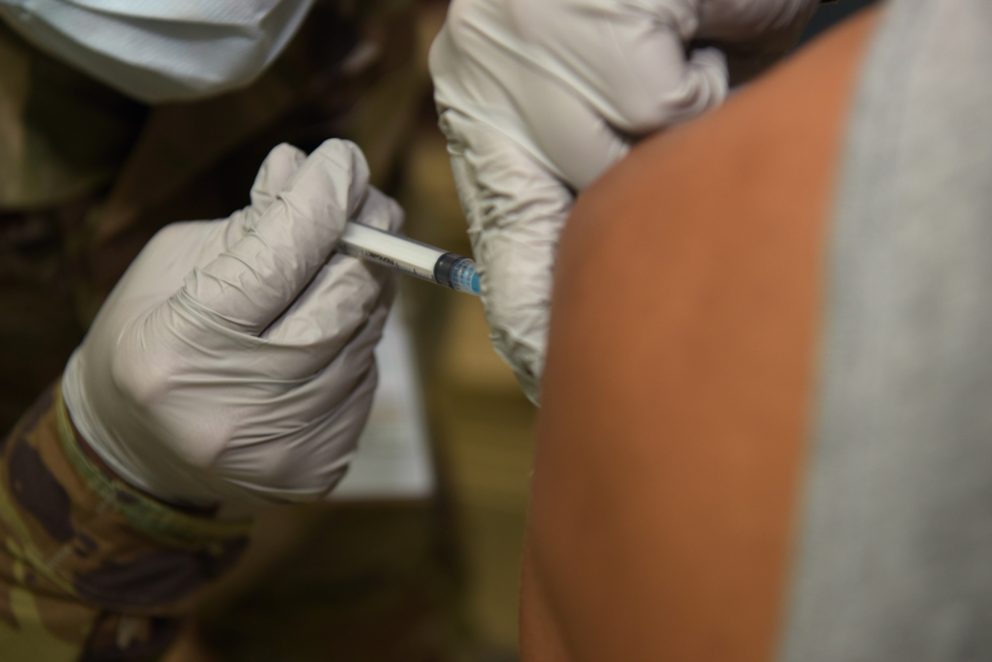 An Airman receives a shot.