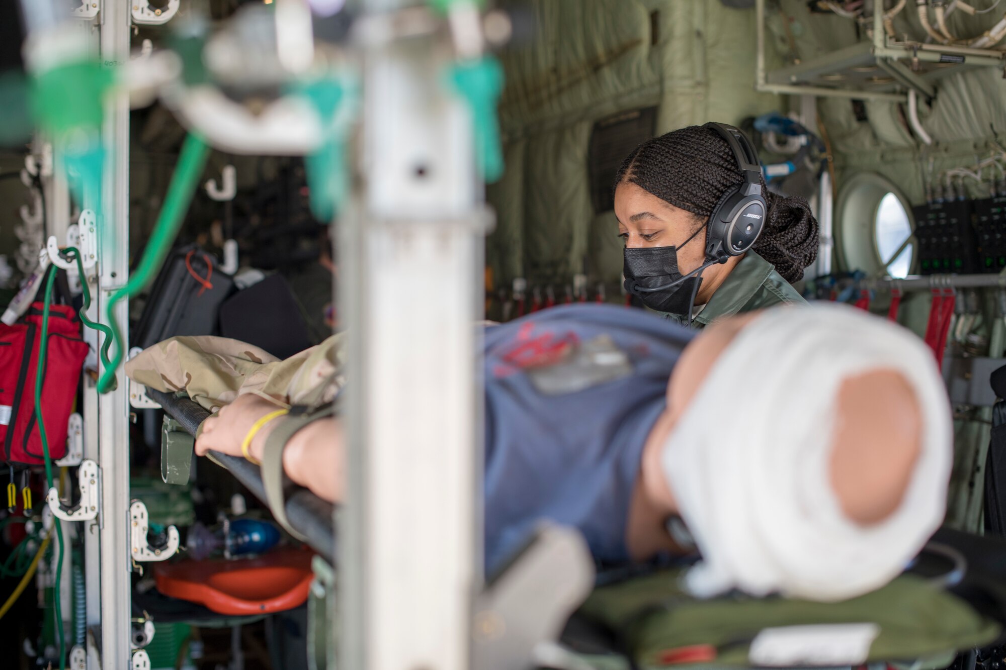 Capt. Toya Williams, 36th Aeromedical Evacuation flight nurse, tends to a patient as part of her pre-deployment training at Keesler Air Force Base, Miss., Jan. 13, 2021. Williams will deploy to Ramstein Air Base, Germany where she will be a part of the 10th Expeditionary Aeromedical Evacuation Flight. (U.S. Air Force photo by Senior Airman Kristen Pittman)