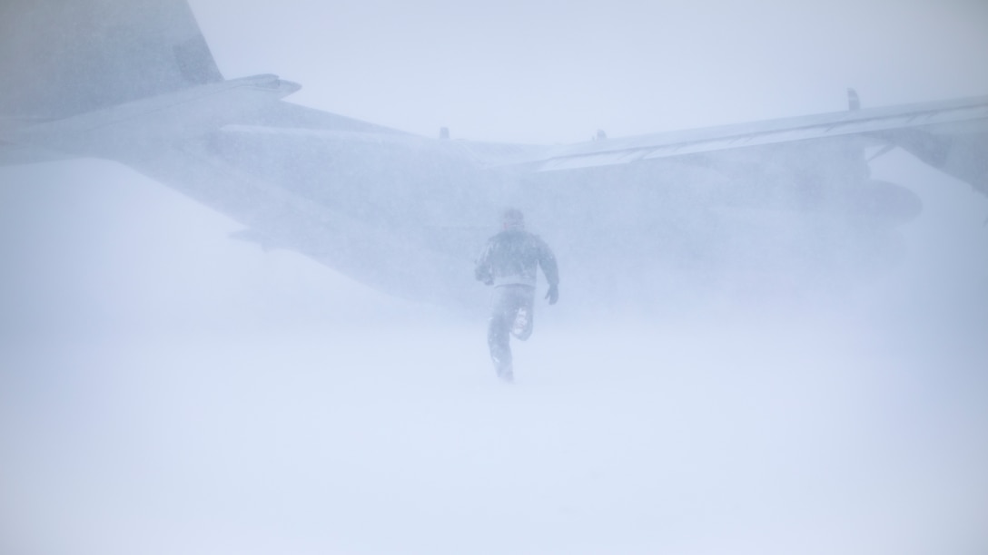 A U.S. Marine returns to a KC-130J Super Hercules aircraft at Eareckson Air Station, Alaska, Dec. 24.