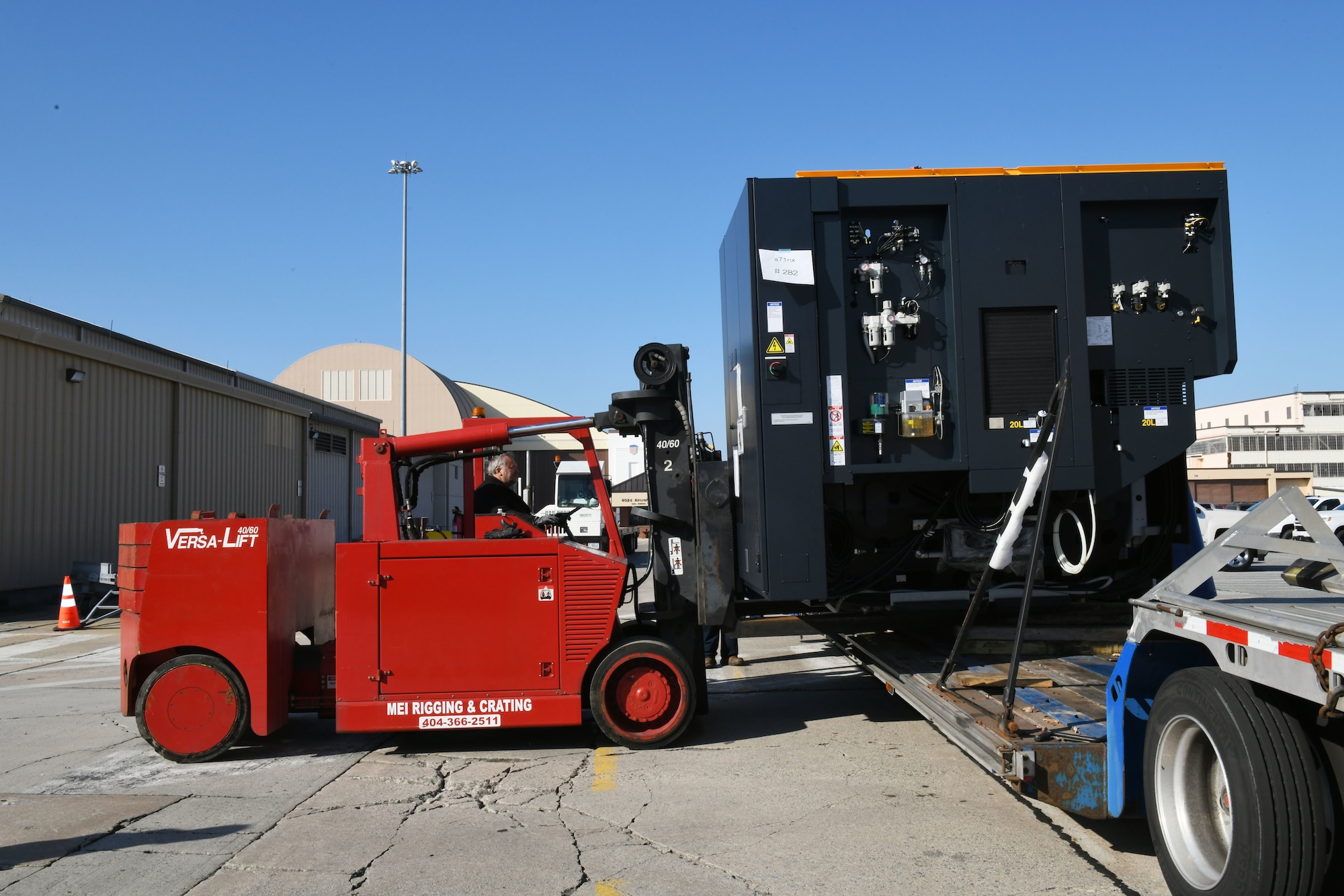 Forklift unloads truck