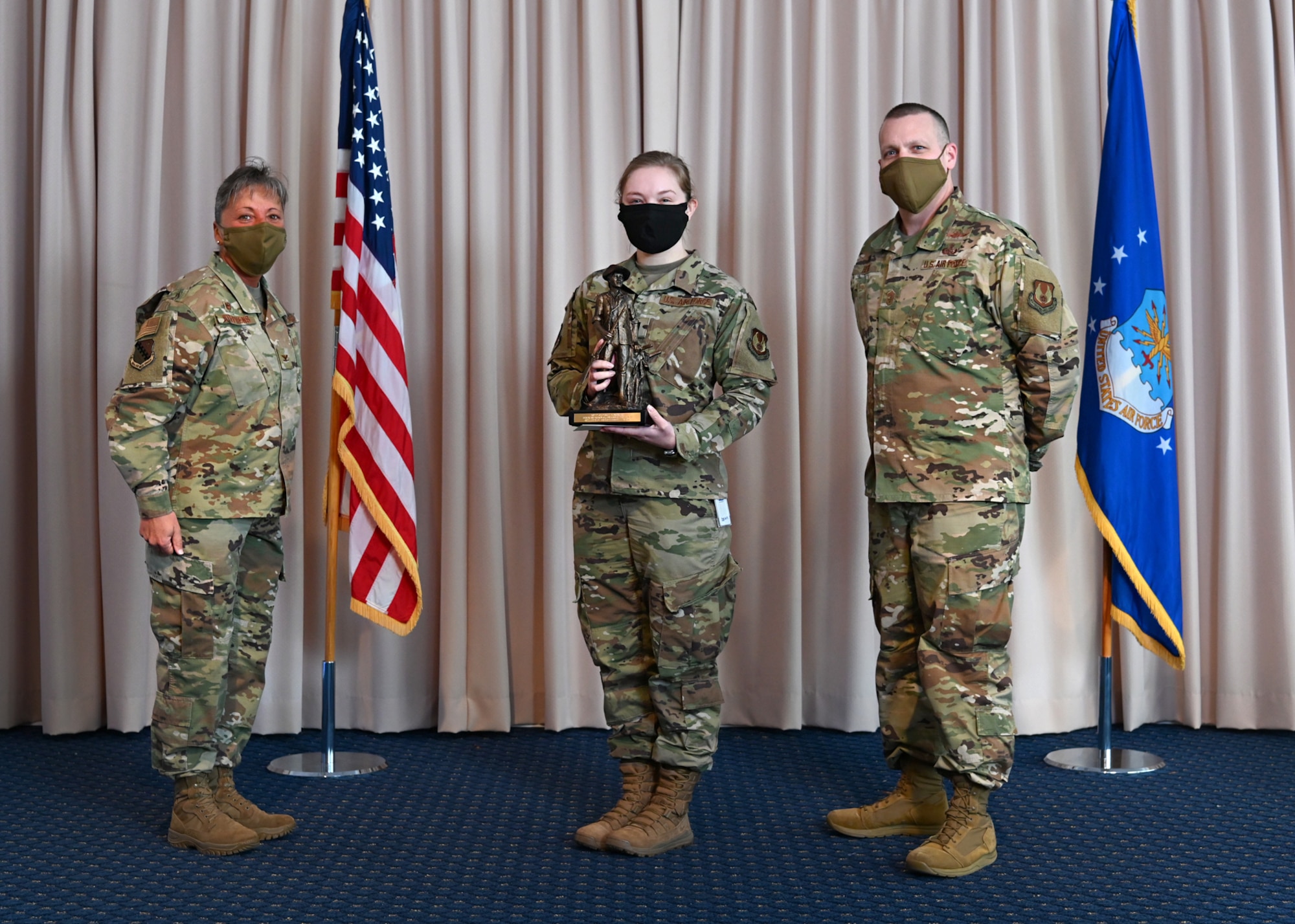 Col. Katrina Stephens, 66th Air Base Group commander, and Chief Master Sgt. Bill Hebb, 66 ABG command chief, present 1st Lt. Amanda Marciniak with the 2020 Base Honor Guard Member of the Year award at Hanscom Air Force Base, Mass., Jan 20.