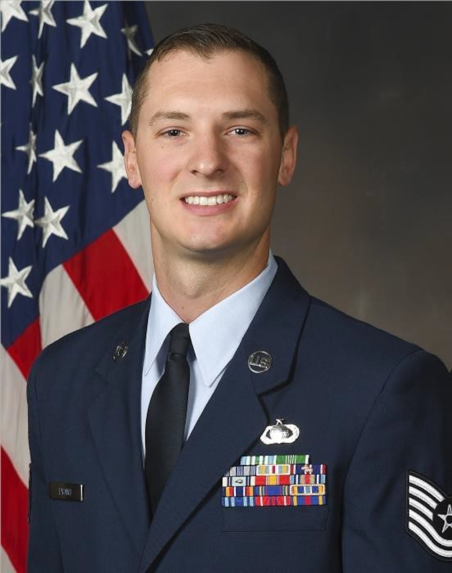 Tech. Sgt. Zachary Evans poses for a portrait in his dress uniform.