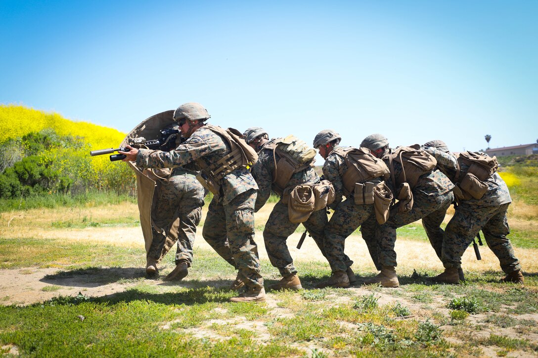U.S. Marines with 2nd Battalion, 4th Marine Regiment, 1st Marine Division (MARDIV), run to a breached door during the Urban Leaders Course (ULC), at Marine Corps Base Camp Pendleton, California, April 22, 2019. The ULC enhances Marines' skills and leadership abilities as small unit leaders in urban combat. (U.S. Marine Corps photo by Cpl. Audrey M. C. Rampton)