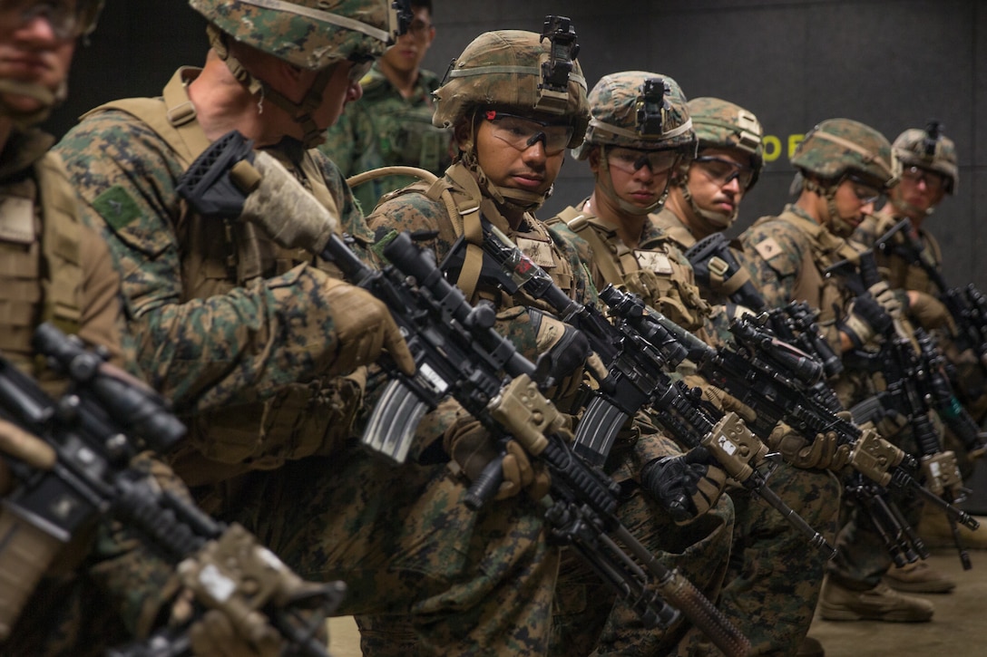 U.S. Marines with 2nd Battalion, 7th Marine Regiment, 1st Marine Division, participate in a simulated assault during exercise Valiant Mark 2019, at the Multi-Mission Range Complex, Singapore, April 16, 2019. Exercise Valiant Mark 2019 is a bilateral exercise between Singapore and the United States which builds international relationships and exchanges tactical knowledge of conventional and heliborne operations. (U.S. Marine Corps photo by Lance Cpl. Roxanna Ortiz)