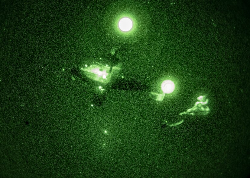 A C-145A Skytruck drops a hand-toss bag rigged to a parachute as part of an aerial delivery training exercise on the Eglin Range, Florida on Jan. 6, 2021.