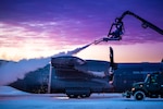 While participating in exercise Emerald Warrior 20, members of Squadron 721 of the Royal Danish Air Force prepare their C-130J Hercules for flight at Alpena Combat Readiness Training Center, Alpena, Michigan, Jan. 21, 2020.