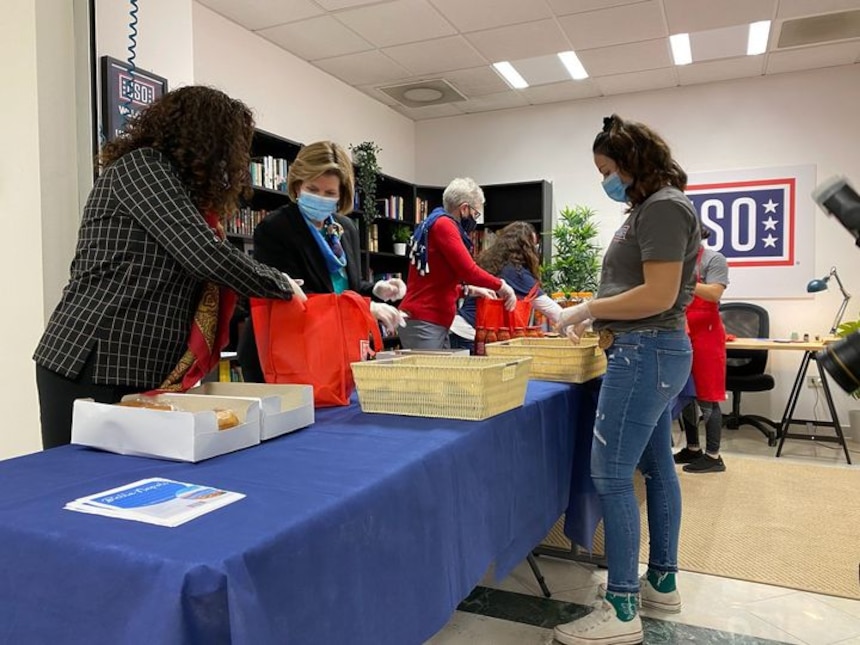 Preparing care packages at table