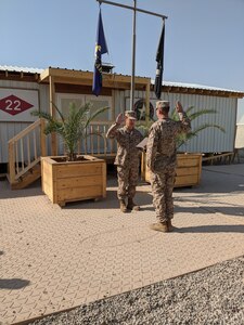 Camp Wolfe, Iraq (July 20, 2020) Builder First Class Sean Maestas is reenlisted by Lt. Cmdr. James Pruitt at Camp Wolfe, Iraq.