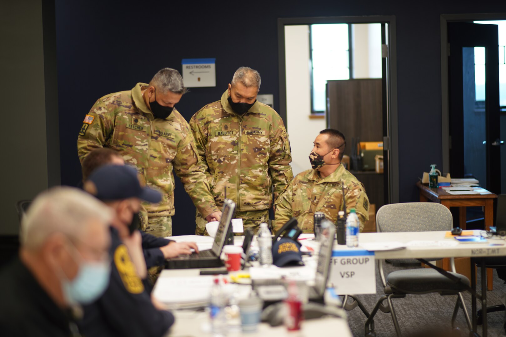 U.S. Army Soldiers with the Hawaii National Guard work with Virginia State Police to coordinate traffic security operations, Jan. 20, 2021, Arlington, Va. Some 200 members of the Hawaii Guard helped secure bridges from Virginia over the Potomac River into Washington, D.C., for the presidential inauguration.