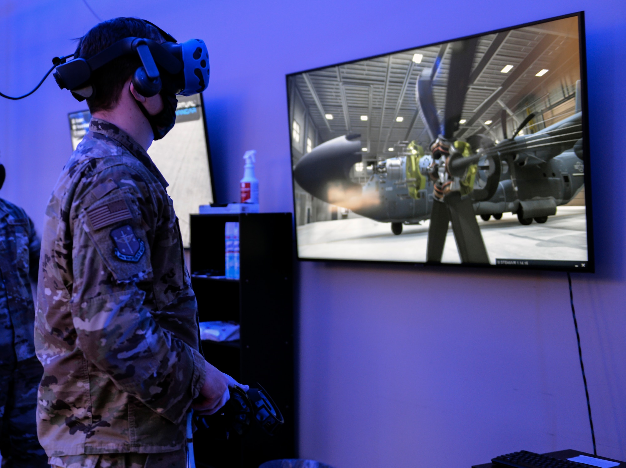 A person utilizes a VR training station