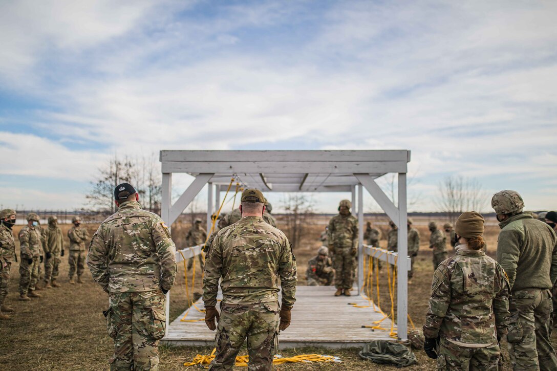 U.S. Army Reserve Paratroopers with the 404th Civil Affairs Battalion and the 450th Civil Affairs Battalion, U.S. Army Civil Affairs & Psychological Operations Command (Airborne), prepare to conduct airborne operations at Joint Base McGuire-Dix-Lakehurst, N.J., Jan. 8, 2021. The units conducted non-tactical airborne operations in order to maintain mission readiness and proficiency among their paratroopers.