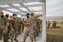 U.S. Army Reserve Paratroopers with the 404th Civil Affairs Battalion and the 450th Civil Affairs Battalion, U.S. Army Civil Affairs & Psychological Operations Command (Airborne), prepare to conduct airborne operations at Joint Base McGuire-Dix-Lakehurst, N.J., Jan. 8, 2021. The units conducted non-tactical airborne operations in order to maintain mission readiness and proficiency among their paratroopers.