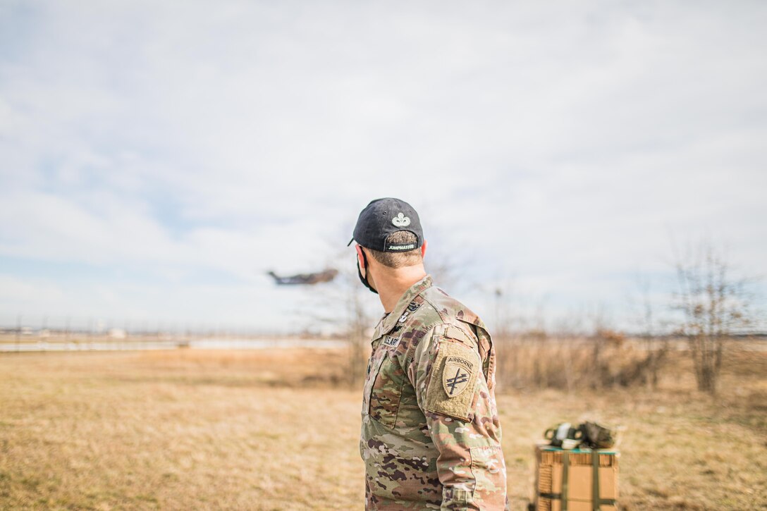 U.S. Army Reserve Lt. Col. JohnPaul Le Cedre, battalion commander of the 404th Civil Affairs Battalion, 304th Civil Affairs Brigade, 353rd Civil Affairs Command, U.S. Army Civil Affairs & Psychological Operations Command (Airborne), watches as a C-130 Hercules aircraft takes flight at Joint Base McGuire-Dix-Lakehurst, N.J., Jan. 8, 2021.