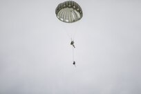 A U.S. Army Reserve Paratrooper navigates the winds during an airborne operation conducted by the 404th Civil Affairs Battalion and the 450th Civil Affairs Battalion, U.S. Army Civil Affairs & Psychological Operations Command (Airborne) at Joint Base McGuire-Dix-Lakehurst, N.J., Jan. 8, 2021. The unit conducted non-tactical airborne operations in order to maintain mission readiness and proficiency among their paratroopers.