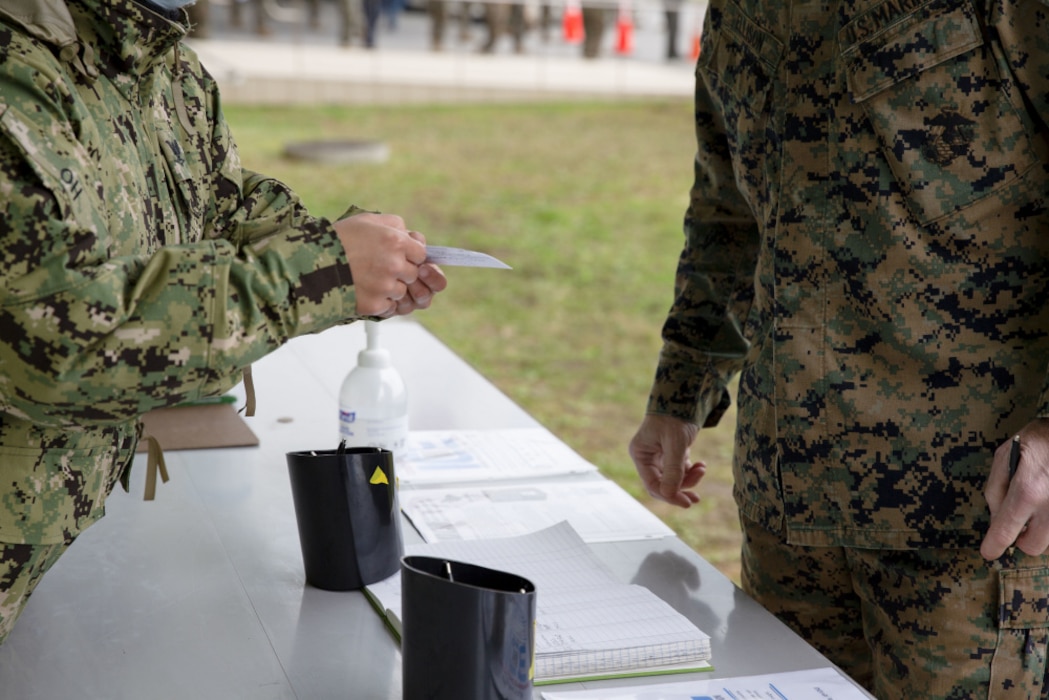 U.S. Marines and sailors with III Marine Expeditionary Force receive COVID-19 vaccines at the U.S. Naval Hospital Okinawa, Camp Foster, Okinawa, Japan, Jan. 12, 2021. Marine Forces Japan is using the DoD’s phased approach to vaccinate all active component, reserve component, TRICARE prime and TRICARE select beneficiaries, and select DoD civilians and contract personnel authorized to receive immunizations from DoD, to remain a lethal and ready expeditionary fighting force. (U.S. Marine Corps photo by Cpl. Francesca Landis)