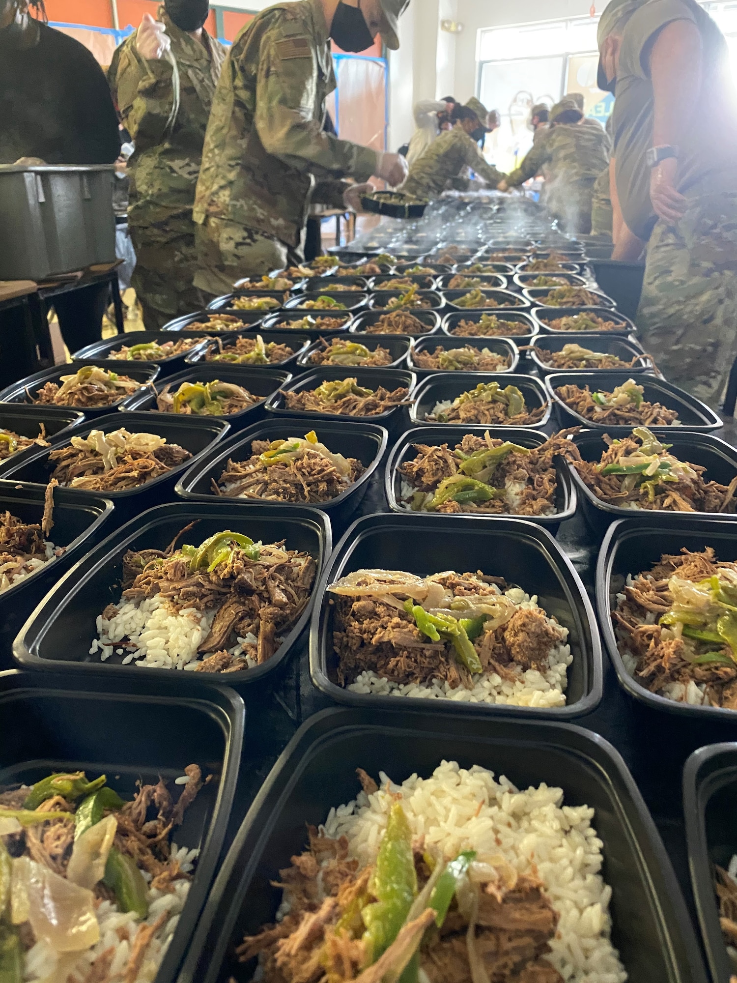 Air National Guard airmen from Arizona, Kentucky, Maryland, Minnesota, Missouri and Tennessee Air Guard assisted restaurant staff, catering staff and volunteers to prepare 15,000 hot meals daily in support of the 59th Presidential Inauguration. (U.S. Air National Guard photo by Staff Sgt. Krishia Baltazar)