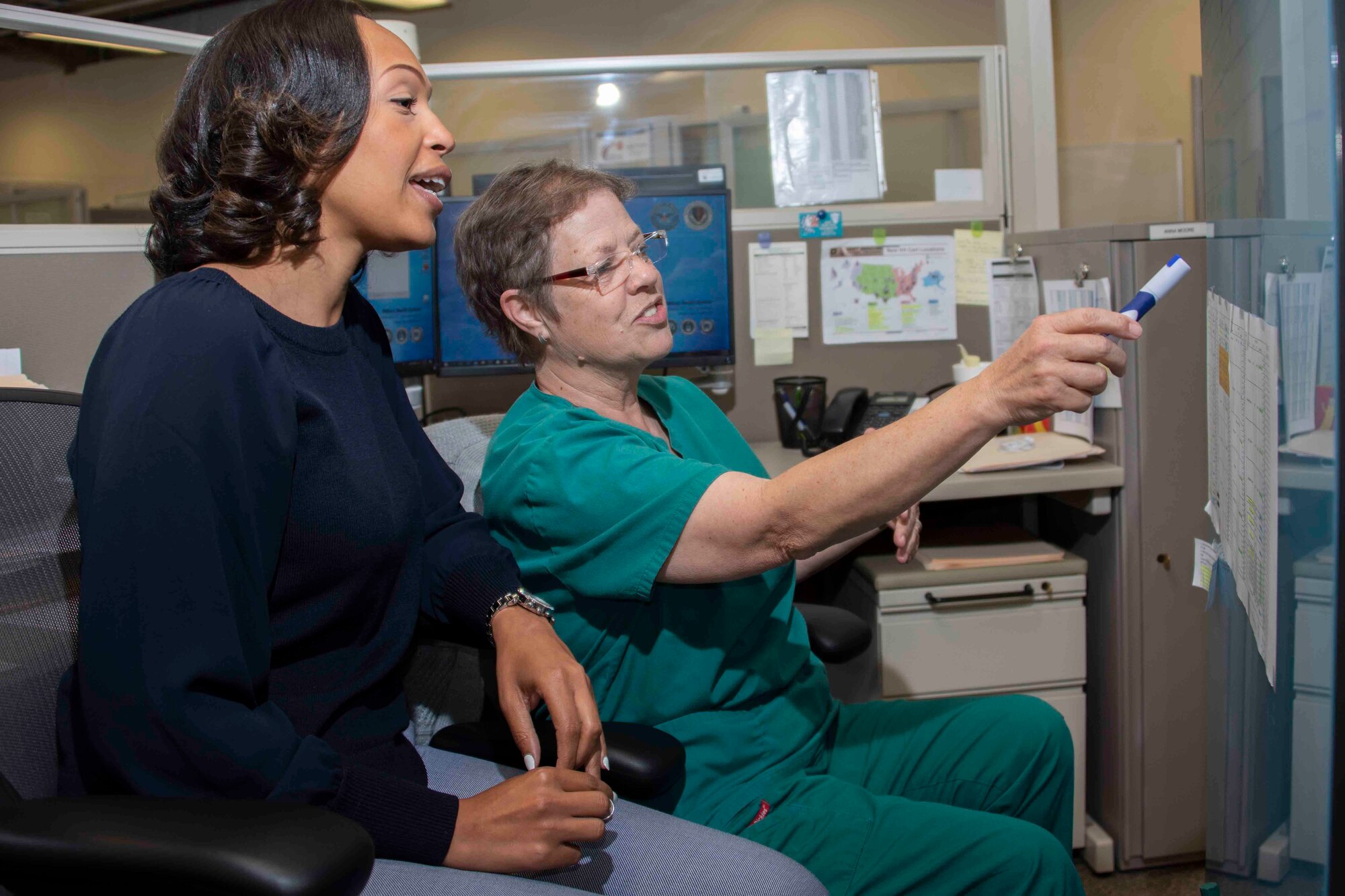 Zekelia Rembert and Anna Moore, virtual health nurse care coordinators, coordinate virtual health projects and outline participating Military Treatment Facilities at the Virtual Medical Center at Joint Base San Antonio-Fort Sam Houston May 16, 2019.