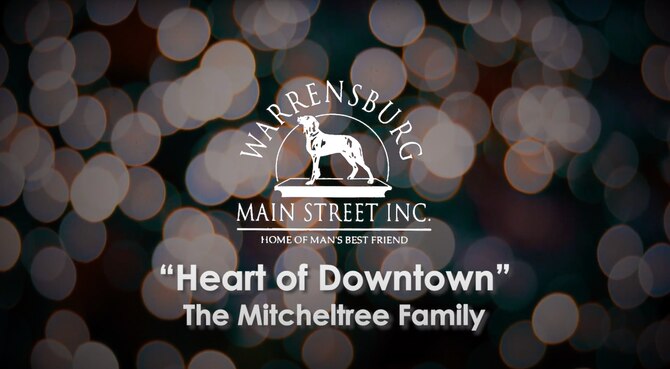 The Mitchelltrees, an Air Force family assigned to Whiteman Air Force Base, Mo., earned the Warrensburg Main Street “Heart of Downtown” award for their volunteer contributions to the Warrensburg Community. The award was revealed during the virtual “Evening of Excellence” Jan. 14, 2021. (Courtesy Graphic by Warrensburg Main Street Inc.)