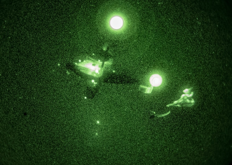 A C-145A Skytruck drops a hand-toss bag rigged to a parachute as part of an aerial delivery training exercise on the Eglin Range, Florida on Jan. 6, 2021.
